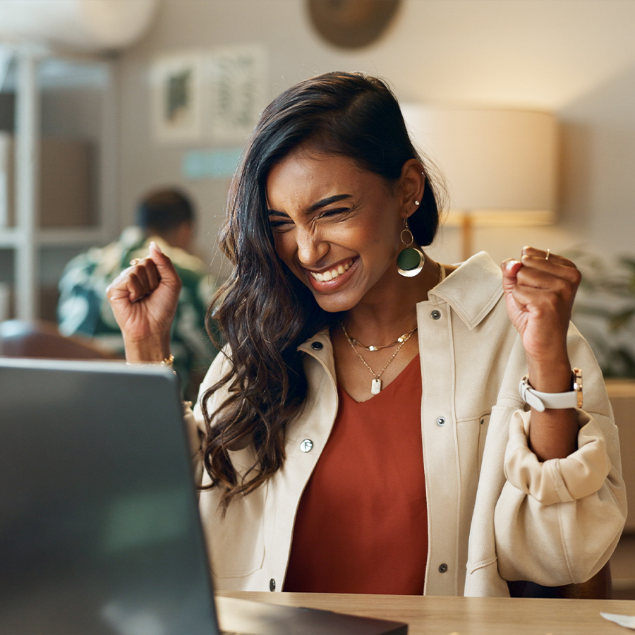 woman happy at laptop