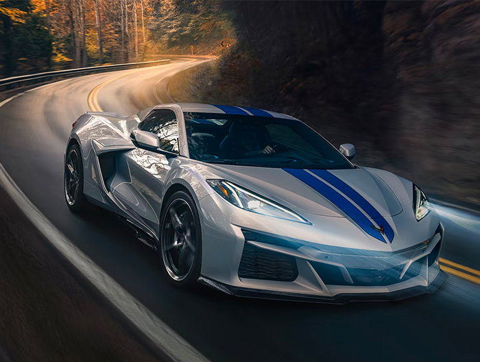 The 2024 Chevy Corvette E-Ray driving on a road