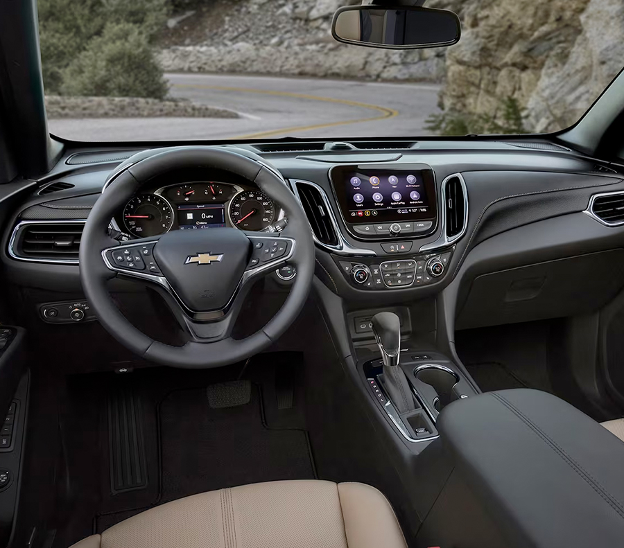 The Equinox's Driver Perspective of the Cabin with a View of an Empty Mountain Road