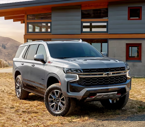 The 2024 Chevy Tahoe Parked in Front of a Modern Home