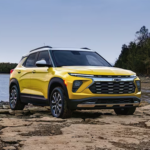 Front 3/4 shot of the 2024 Chevy Trailblazer parked in front of lake