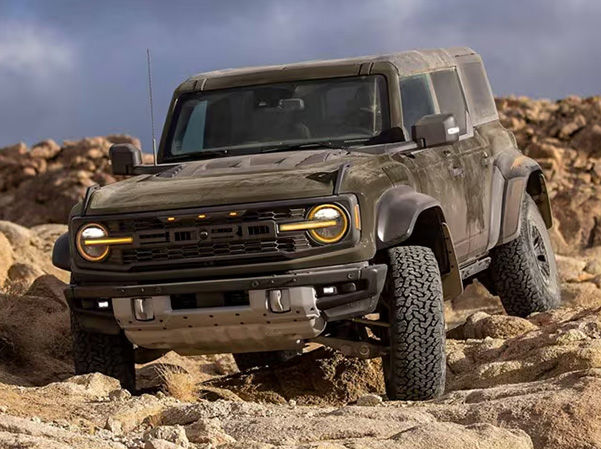 Ford Bronco Raptor driving on rocks