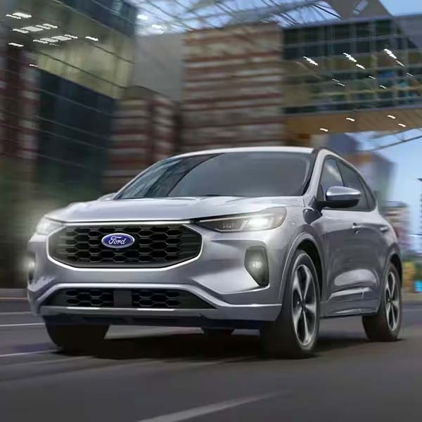 Ford Escape driving down city road