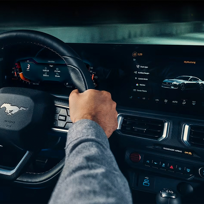 A 2024 Ford Mustang® model interior with a person driving