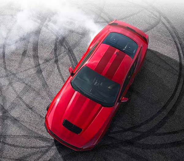 Overhead view of a 2024 Ford Mustang® model with tire tracks on pavement