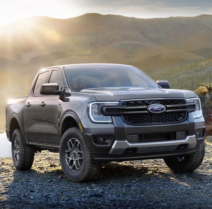 A 2024 Ford Ranger® in Carbonized Gray is parked in a scenic location.