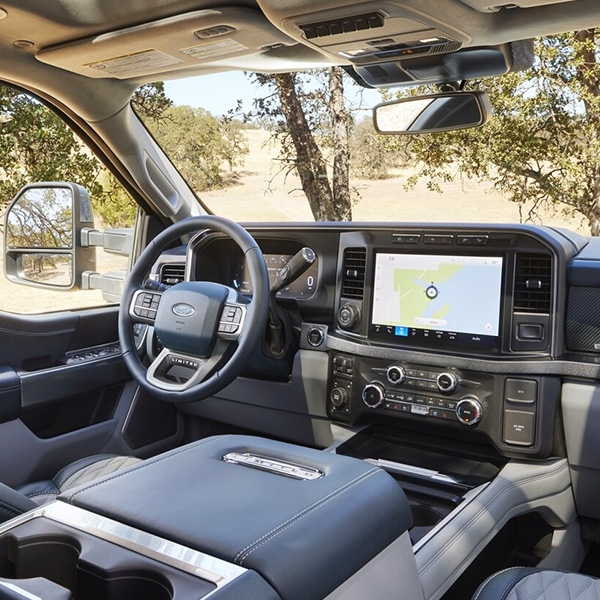 Interior of a 2024 Ford Super Duty® F-350® Limited model showing the front dash panel and large center display touchscreen