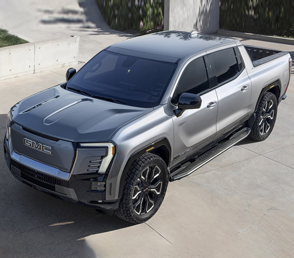 Angled side view of silver 2024 GMC Sierra EV