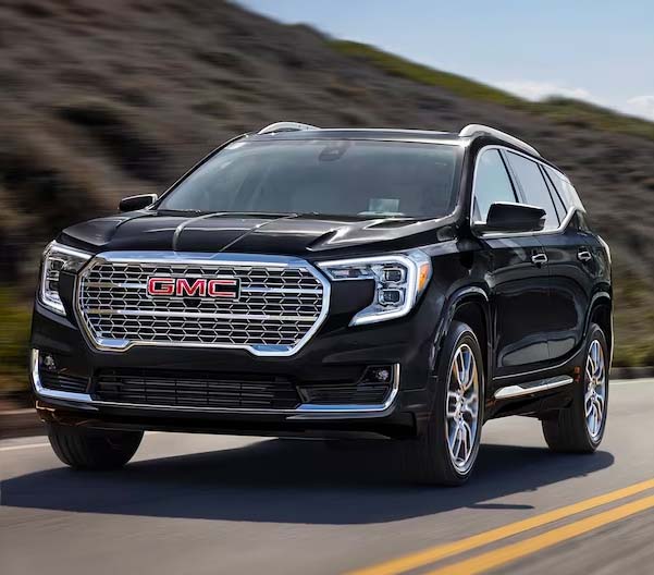 2024 GMC Terrain driving on a road in the mountains