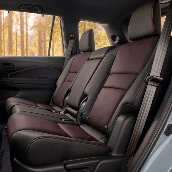 2024 Honda Passport Elite rear interior in Black Leather, displaying spacious 2nd-row seating.