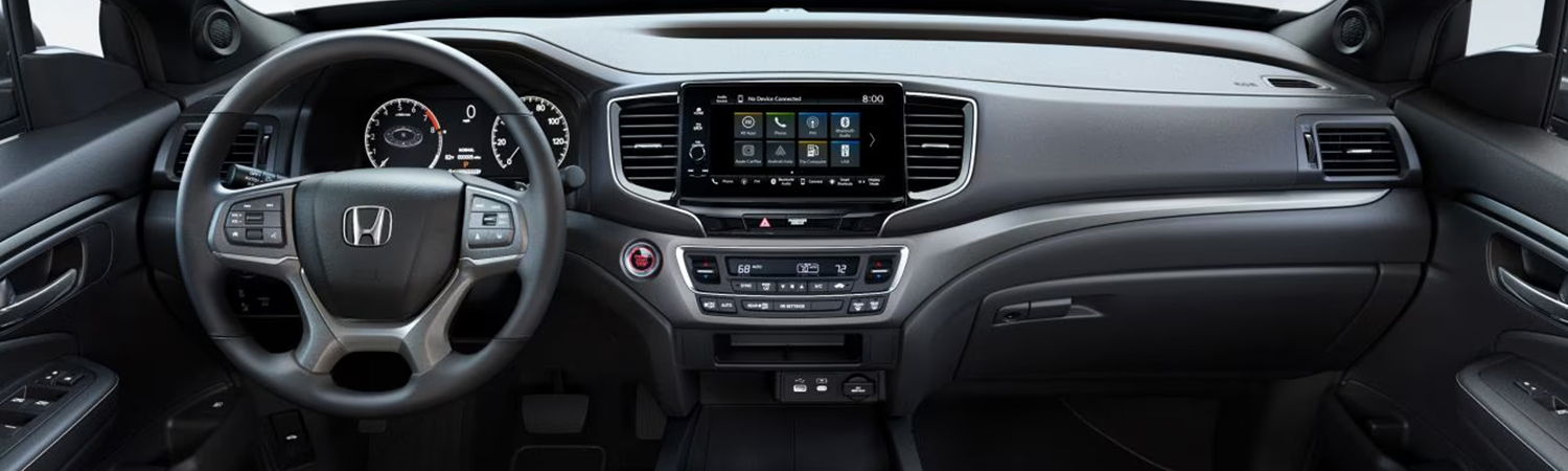 2024 Honda Ridgeline RTL with gray leather interior, view from rear seats showing dash and portion of front seats