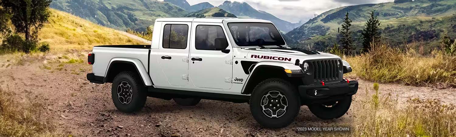 2023 Jeep Gladiator Rubicon parked on dirt path in daytime