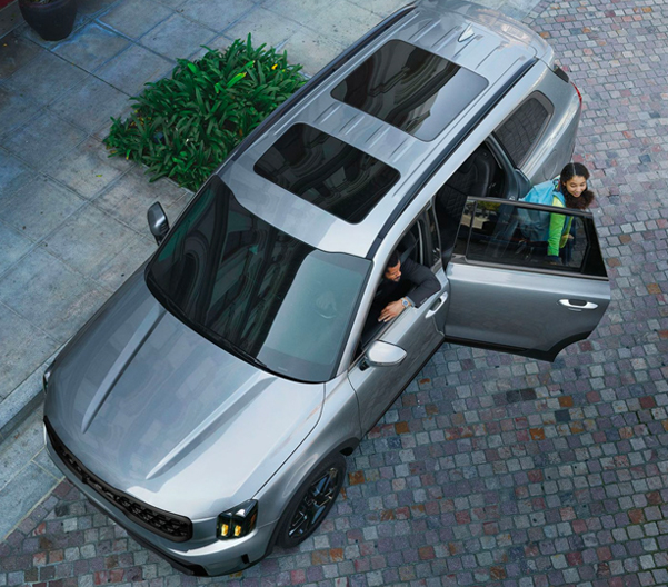 Dad dropping his daughter off on their new Kia Telluride