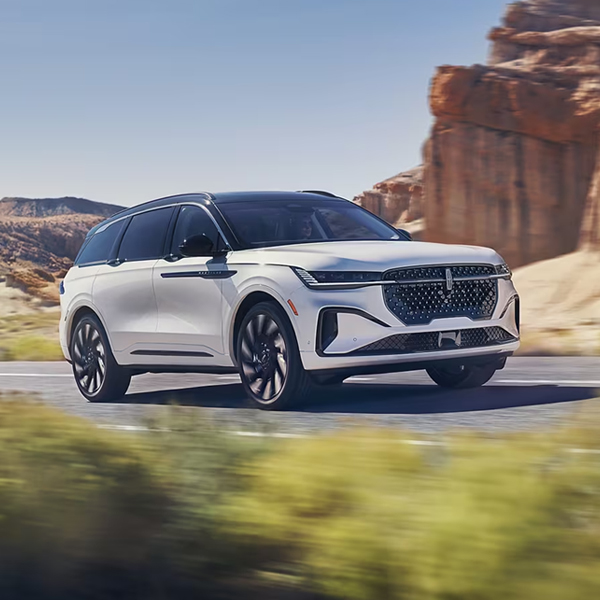 A 2024 Lincoln Black Label Nautilus® SUV is being driven on a desert highway
