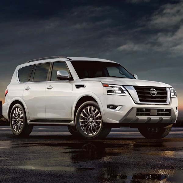 Dramatic shot of the 2024 Nissan Armada with a dark and stormy background