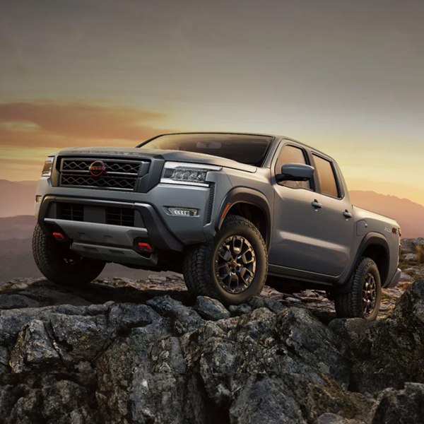2024 Nissan Frontier on a rocky outcrop in the mountains