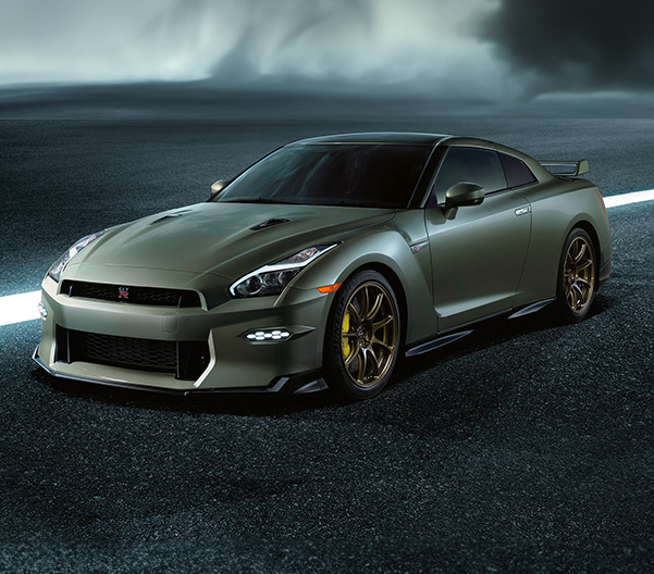 2024 Nissan GT-R® T-spec® in Millennium Jade in 3/4 profile on a gray background.