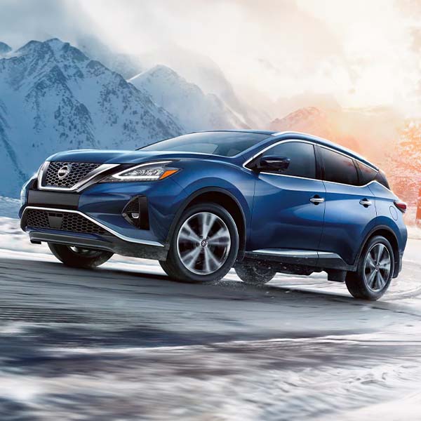 2024 Nissan Murano driving up snowy road