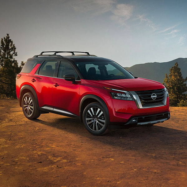 Front 3/4 shot of 2024 Nissan Pathfinder parked on dirt path