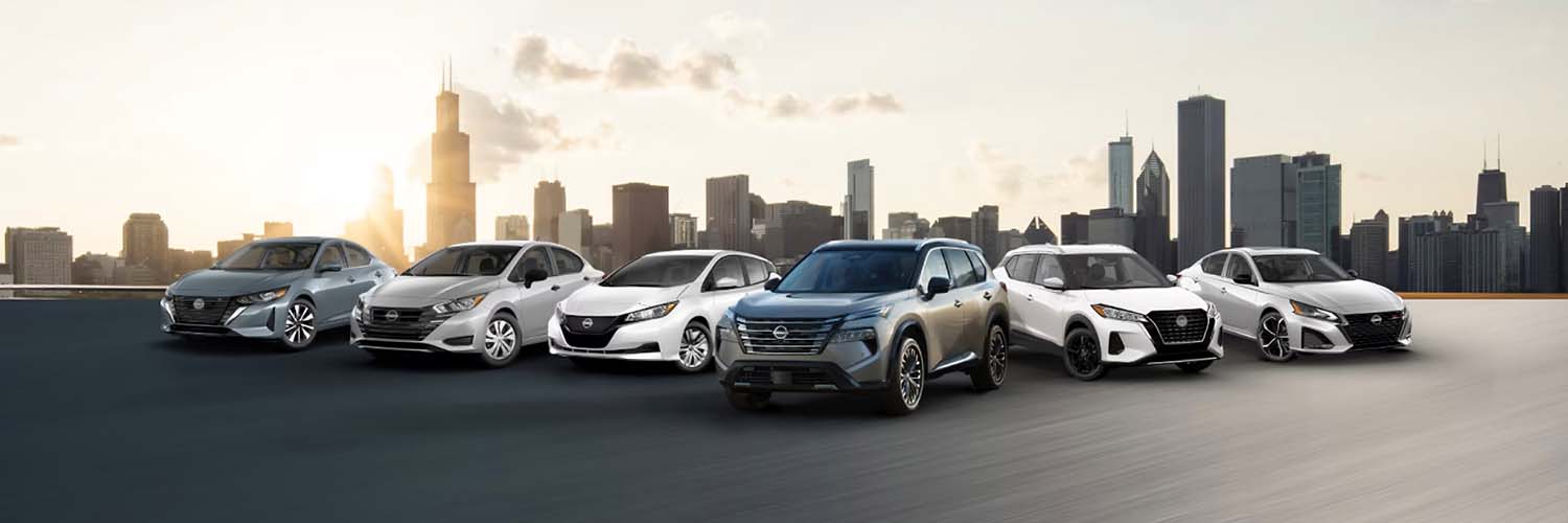 Lineup of Nissan vehicles with a city skyline in the background