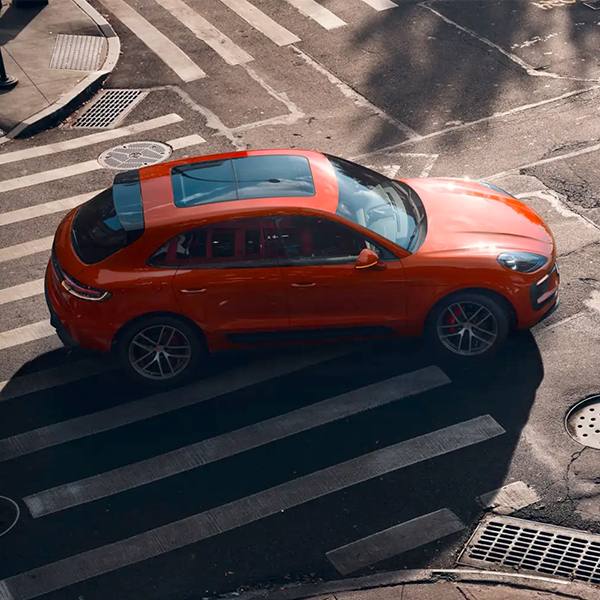2024 Porsche Macan turning on a city street