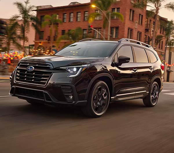2024 Subaru Ascent Onyx Edition Limited shown in Crystal Black Silica driving down city street