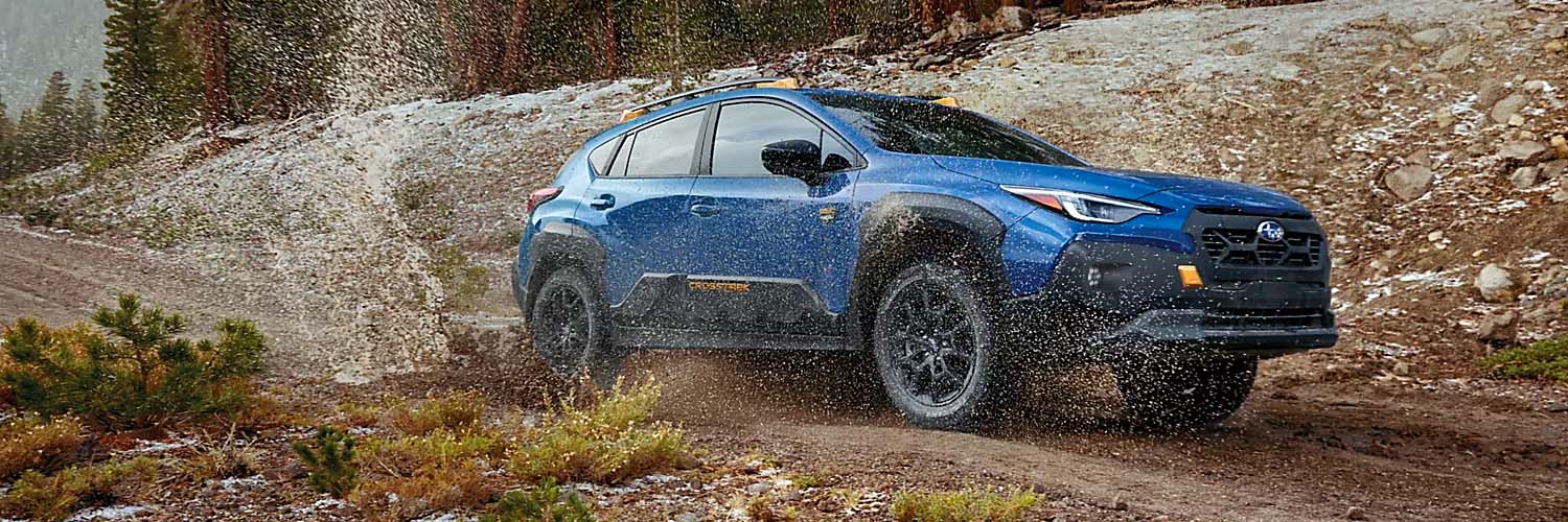 2024 Subaru Crosstrek driving through mud