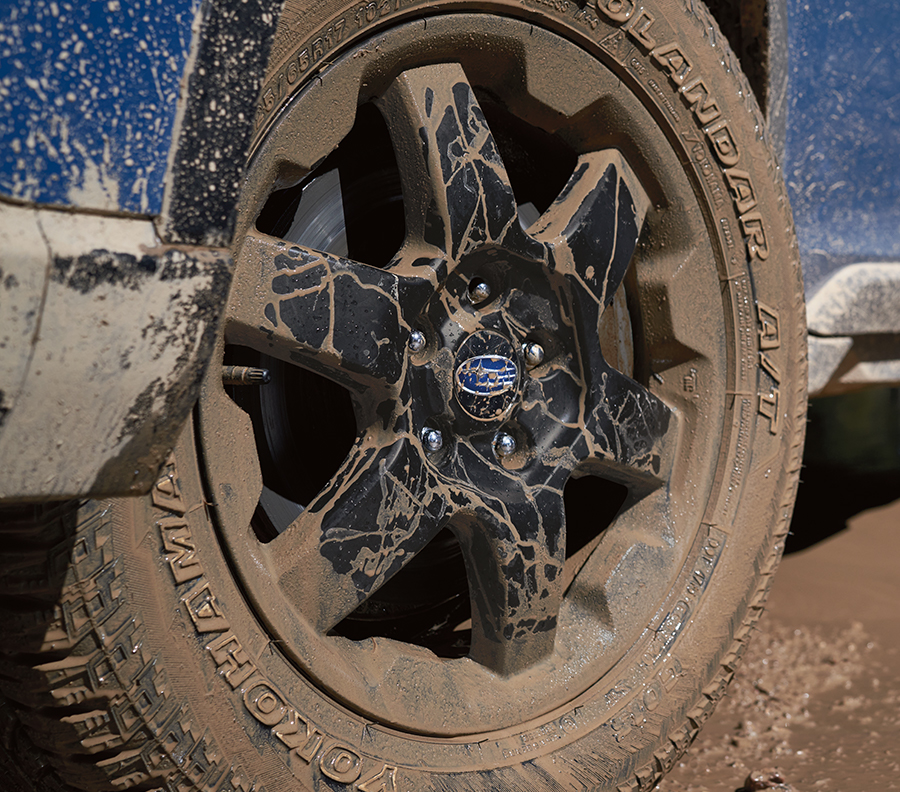 Wilderness 17-inch alloy wheels with matte-black finish and Yokohama Geolandar® all-terrain tires