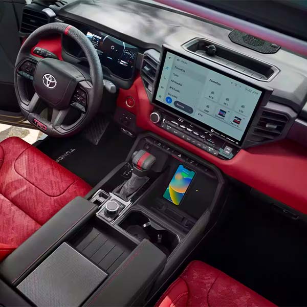 Interior steering wheel and center console view of the 2024 Toyota Tundra