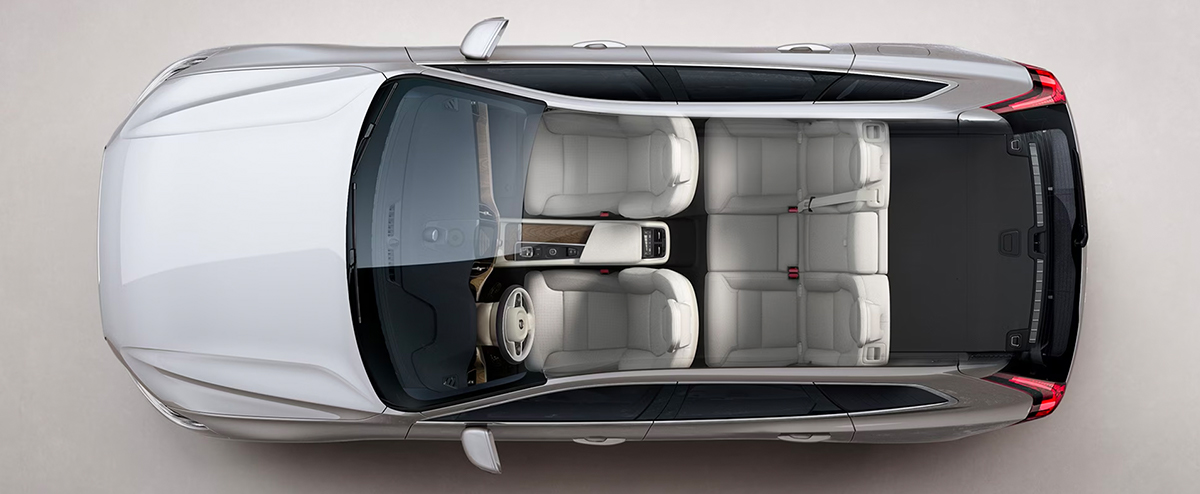 A white Volvo XC60 seen from directly above with interior visible.