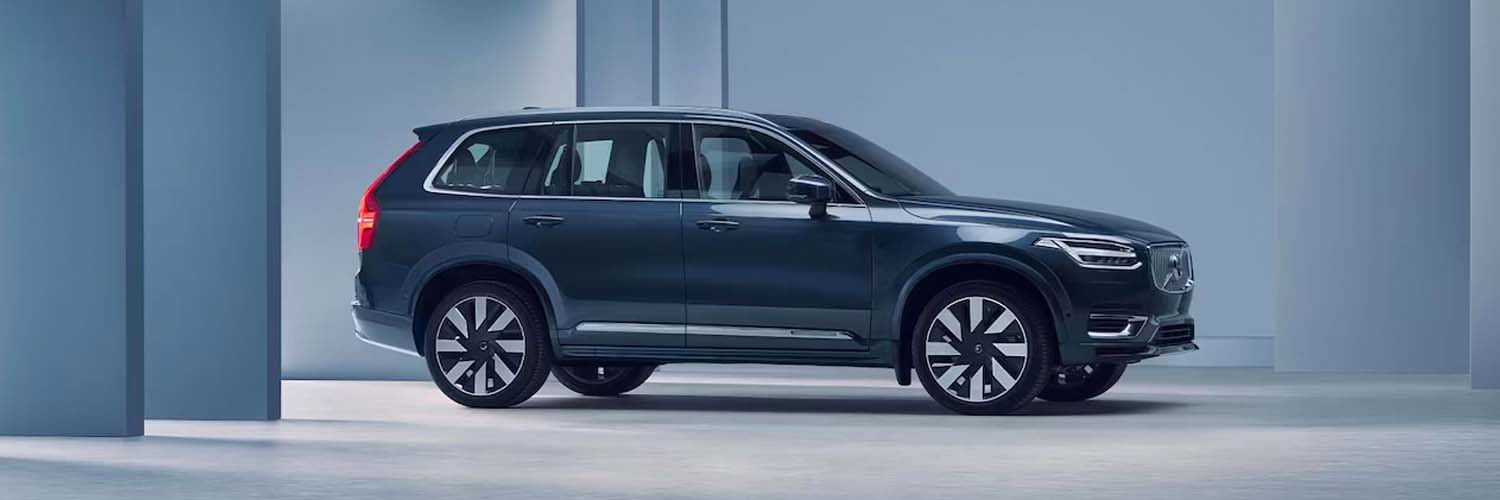 2024 Volvo XC90 Recharge parked in a blue studio.