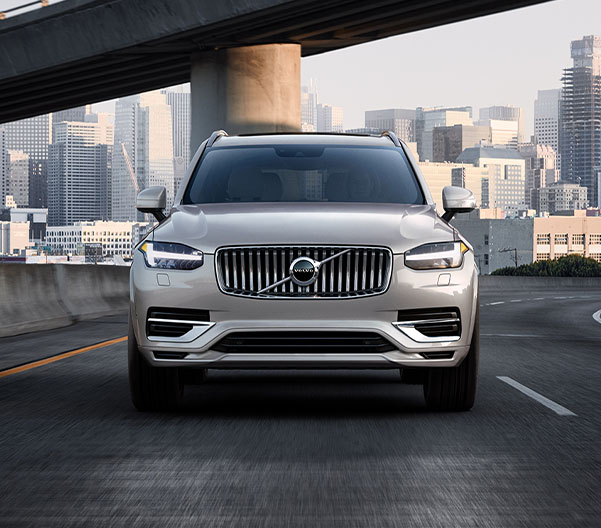 Front shot of 2024 Volvo XC90 driving on city highway
