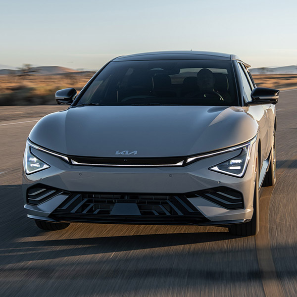 Head on shot of the 2025 Kia EV6 driving down road