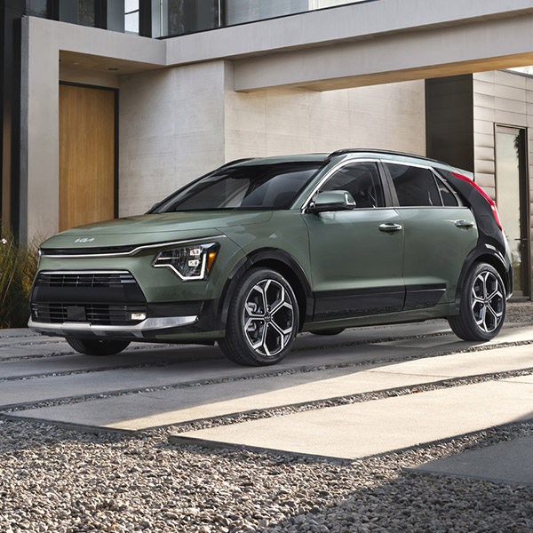Front 3/4 shot of the 2025 Kia Niro Hybrid parked in front of home
