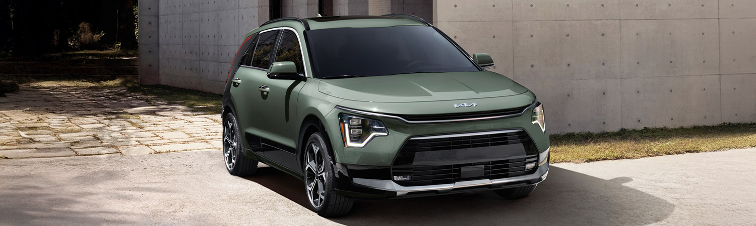 Shot of the 2025 Kia Niro Hybrid parked in front of building