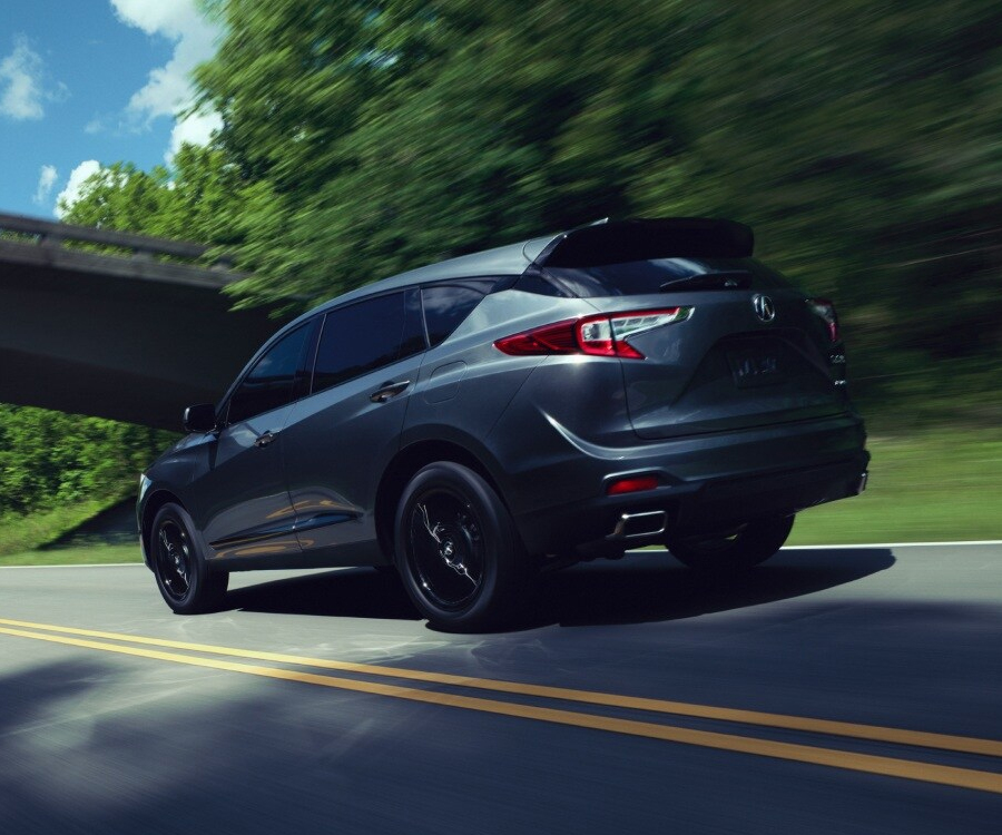 2025 RDX SH-AWD in Liquid Carbon Metallic rear view.