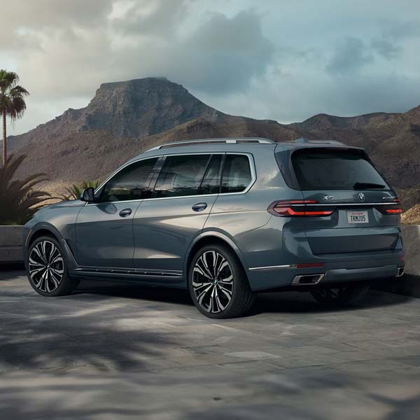 Rear of 2025 BMW X7 parked near mountains