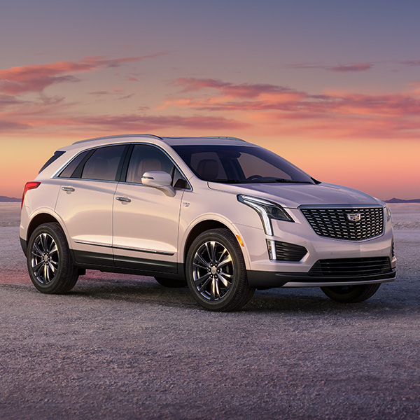 Front 3/4 shot of the 2025 Cadillac XT5 parked on salt flats.