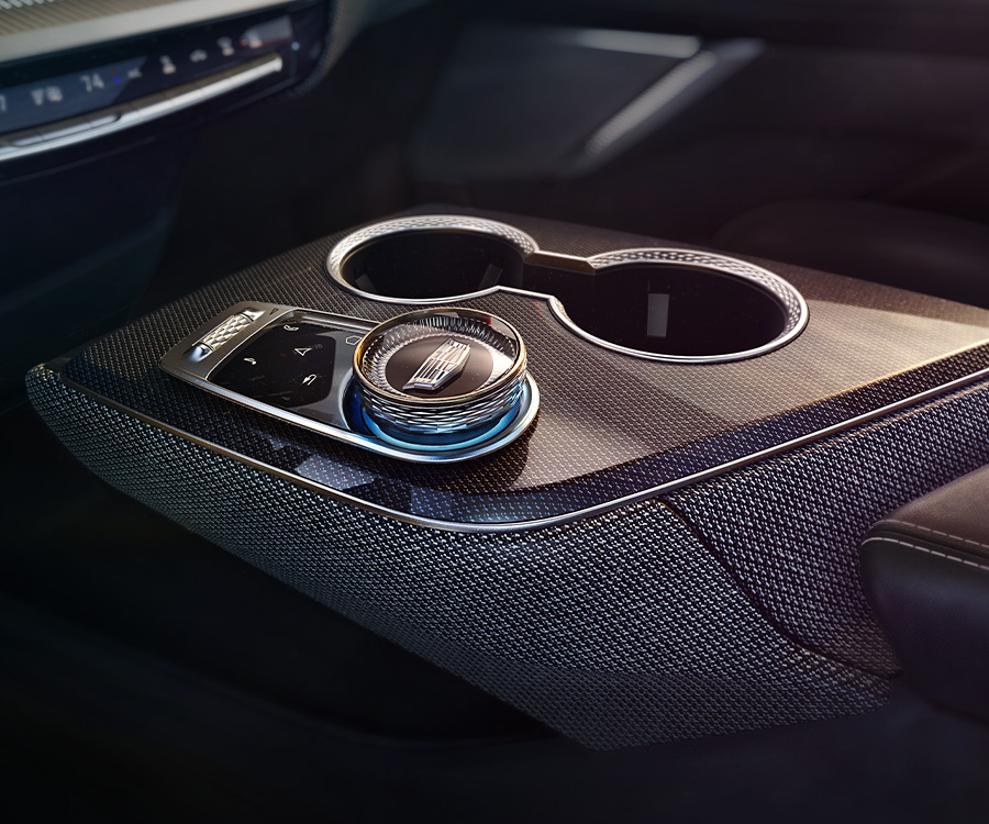 2025 Cadillac Optiq Reveal Sport Black Noir Interior, center console shifter knob and cupholders