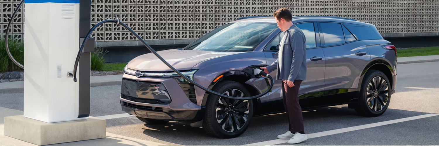 Shot of person charging 2025 Chevrolet Blazer EV in lot
