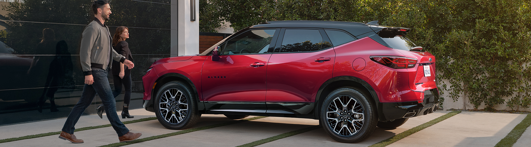 A Couple Walking to Their 2025 Blazer Parked in the Driveway