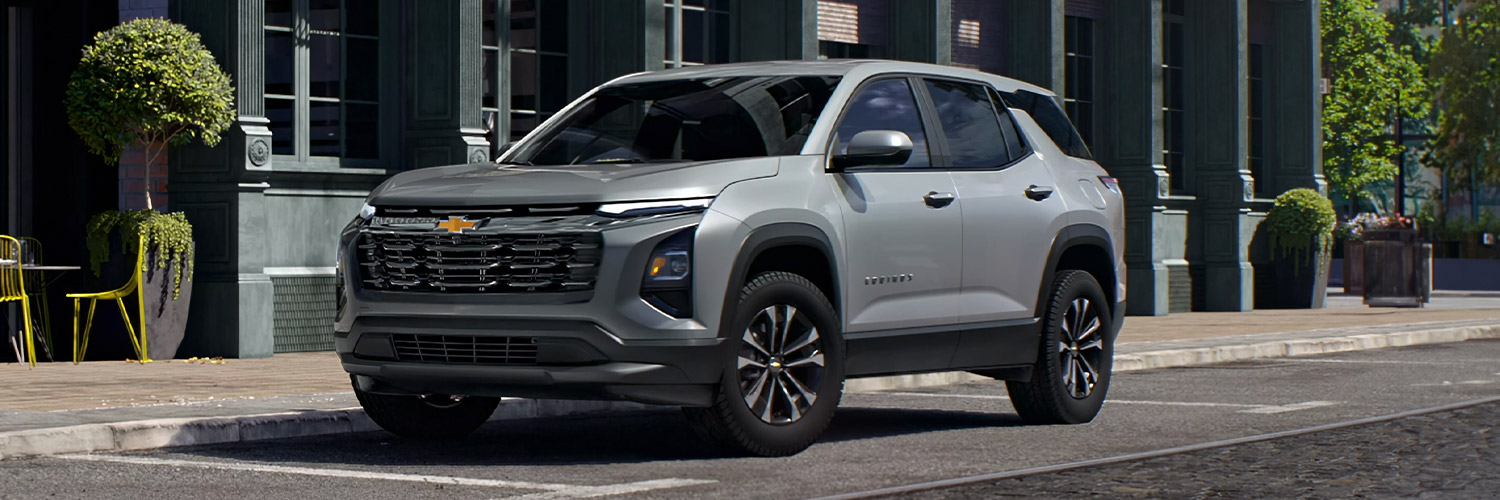 Front 3/4 shot of the 2025 Chevy Equinox parked on side of city street