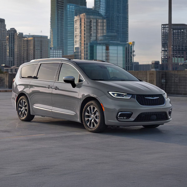 Grey 2025 Pacifica Plug-In Hybrid parked in an urban parking lot