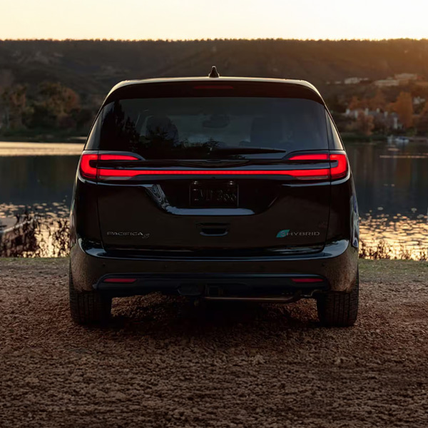 Rear 2025 Chrysler Plug-in Hybrid parked near a body of water