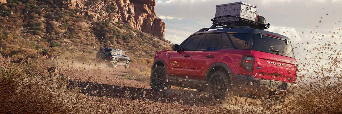 2025 Bronco Sport driving through a dirt path in the desert