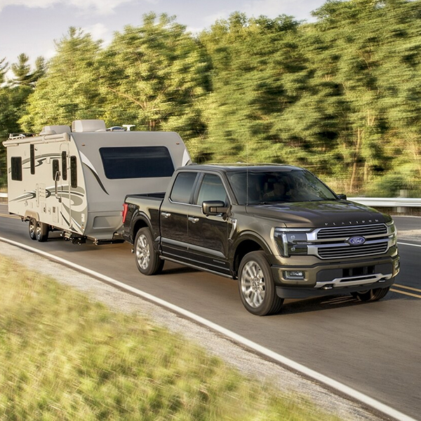 Ford F150 racing down a road