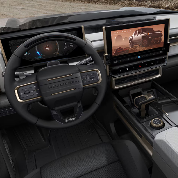 Interior steering wheel and dashboard of 2025 GMC HUMMER EV Pickup.