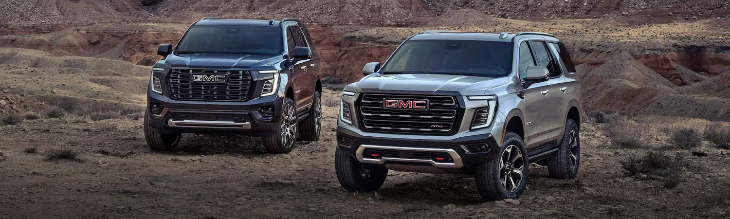 2025 GMC Yukon models parked on grass
