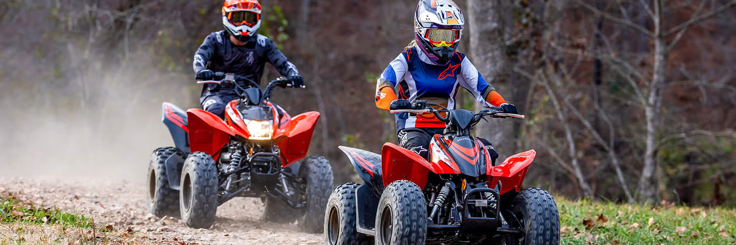 people on honda atvs