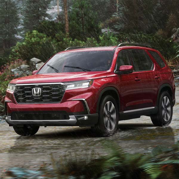 2025 Honda Pilot driving in the rain